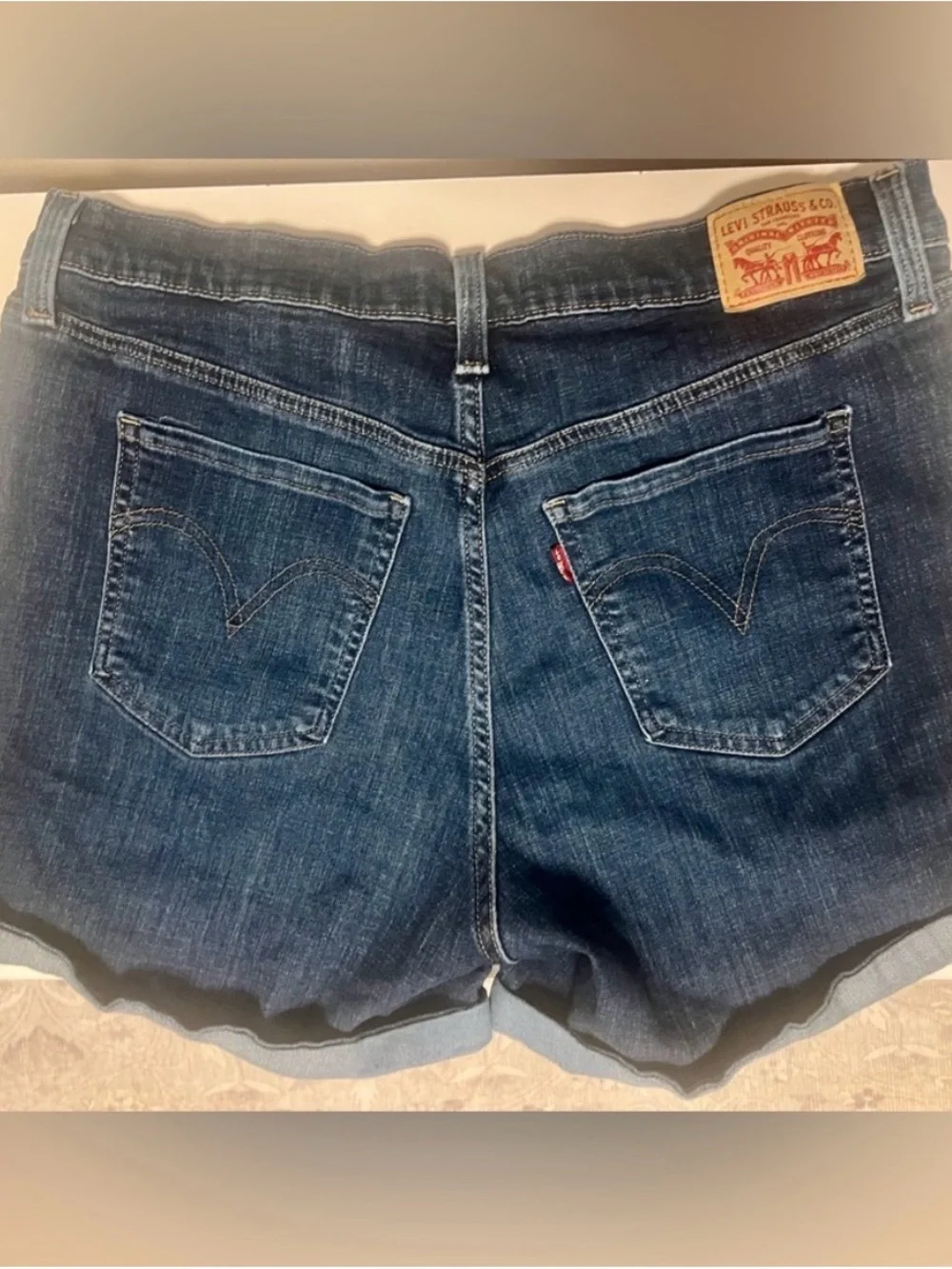 Levi's Dark Blue Denim with Tan Stitch Button Close-Up - Picture 2 of 9